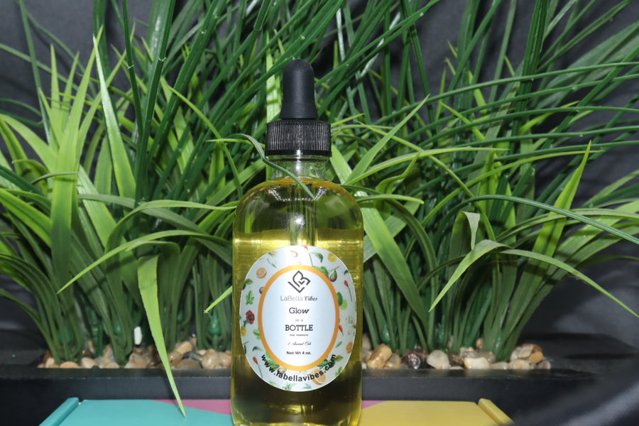 glow in a bottle facial hydration oil with grass behind it 
