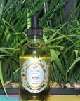glow in a bottle facial hydration oil with grass behind it 